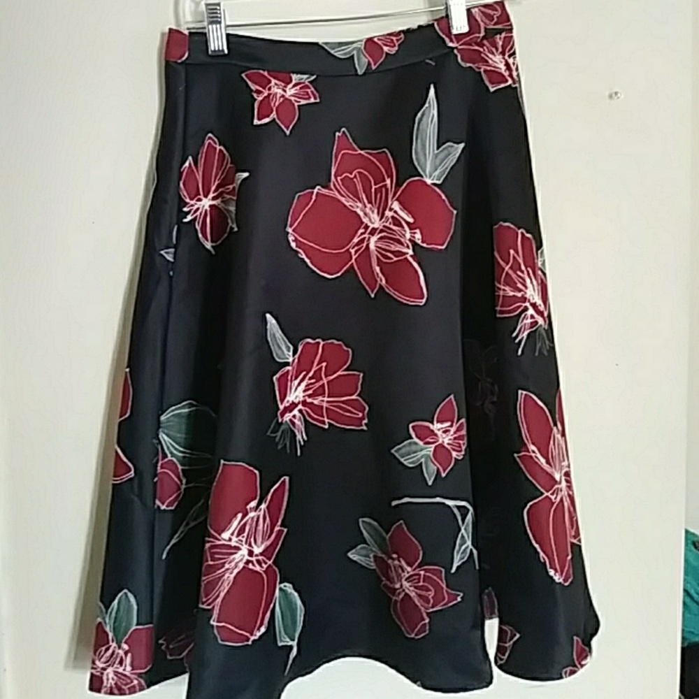 Knee length black skirt with red flower pattern